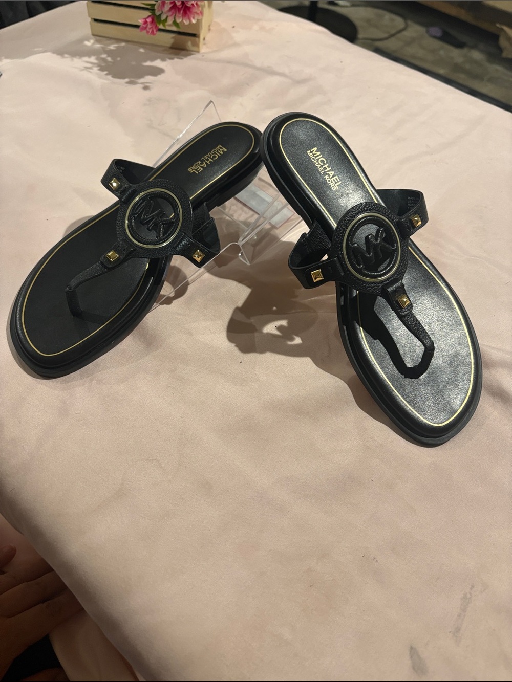 MICHAEL Michael Kors Black Thong Sandals with Gold Accents